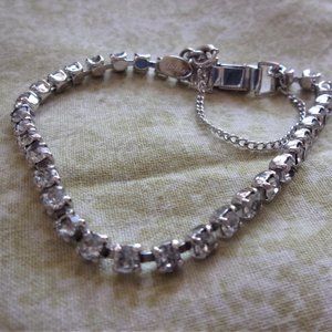 Denbe Rhinestone and silvertone tennis bracelet